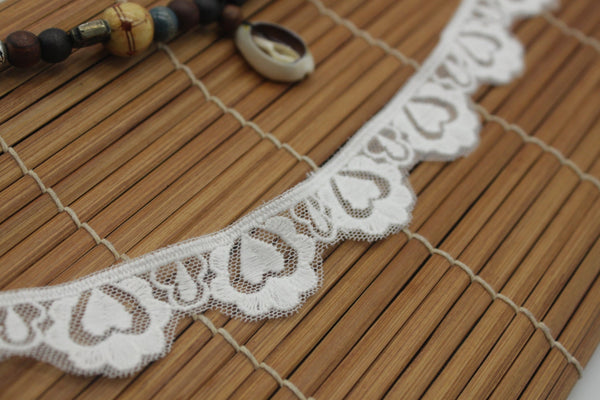 White cotton lace ribbon with heart pattern and scalloped edge, 1 inches wide