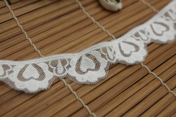 White cotton lace ribbon with heart pattern and scalloped edge, 1 inches wide